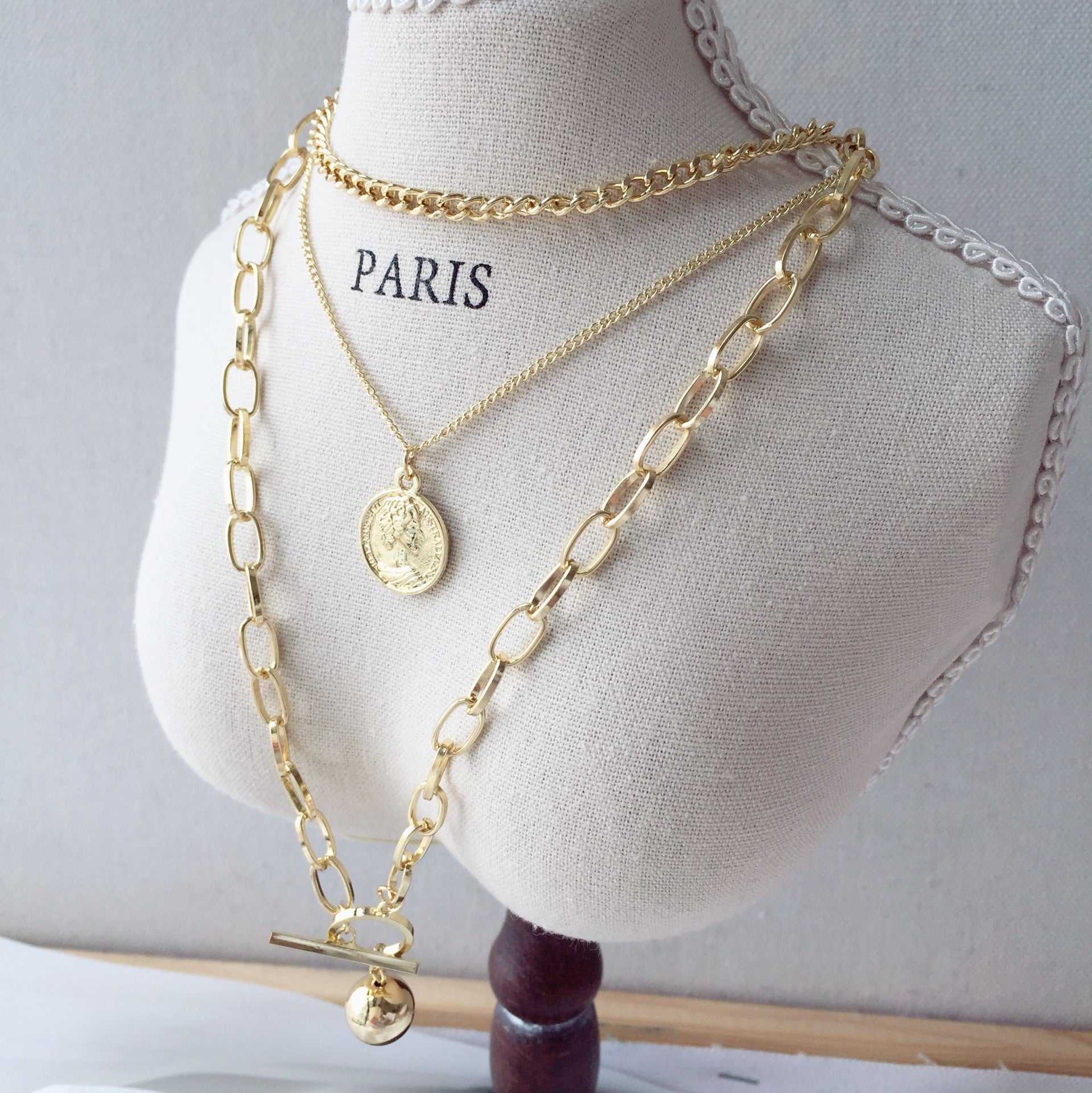 Medal layered necklace